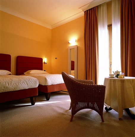 Imagen de la habitación del Hotel Tombolo Talasso Resort. Foto 3