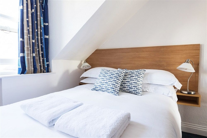 Imagen de la habitación del Hotel Tommy Jacks. Foto 10