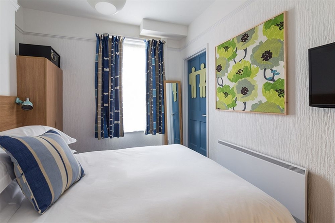 Imagen de la habitación del Hotel Tommy Jacks. Foto 11