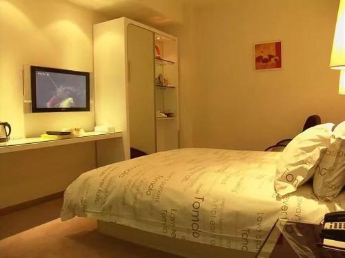 Imagen de la habitación del Hotel Tomolo Wuzhan Branch. Foto 9