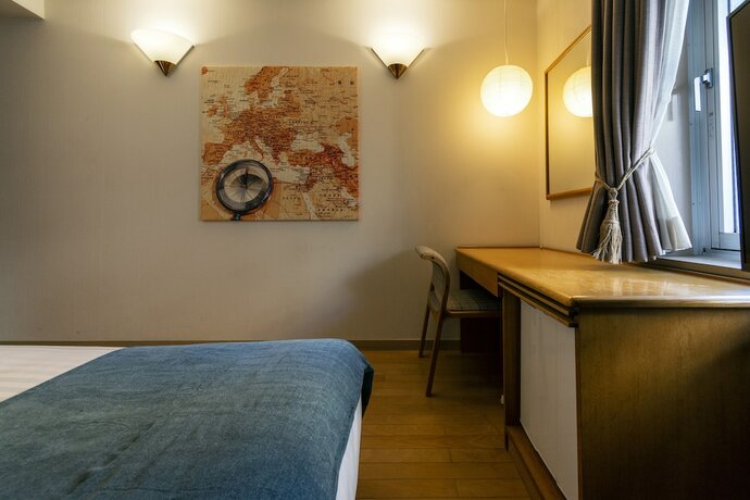 Imagen de la habitación del Hotel Toms. Foto 19