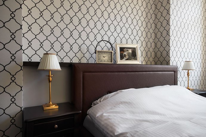 Imagen de la habitación del Hotel Too-good Apartments. Foto 5