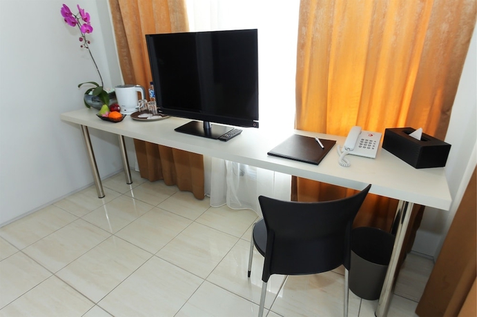 Imagen de la habitación del Hotel Topaz Residence. Foto 16