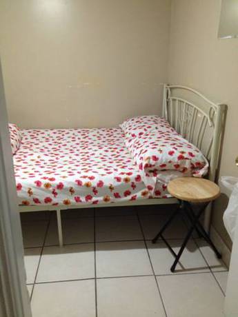 Imagen de la habitación del Hotel Toronto Travellers Home. Foto 11