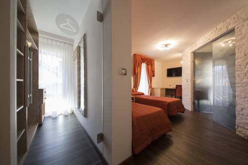 Imagen de la habitación del Hotel Touring, Predazzo. Foto 13