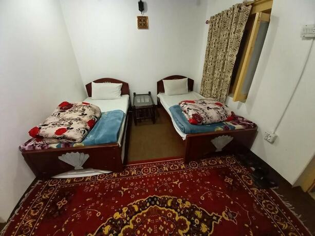Imagen de la habitación del Hotel Tourist Cottage Hunza. Foto 16