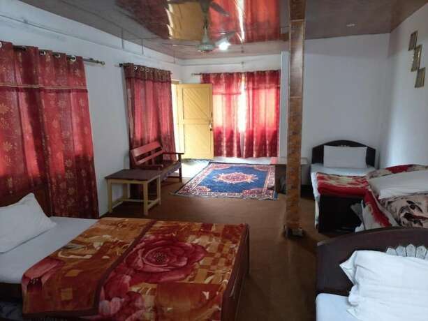 Imagen de la habitación del Hotel Tourist Cottage Hunza. Foto 17