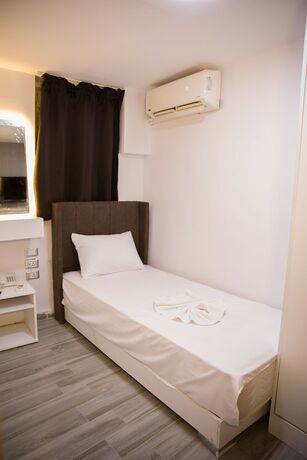 Imagen de la habitación del Hotel Tourist Palace. Foto 12