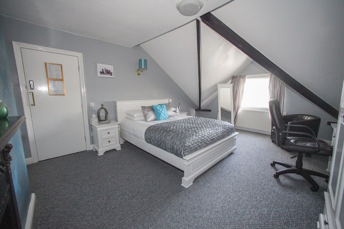 Imagen de la habitación del Hotel Tower House Executive Guest House. Foto 4