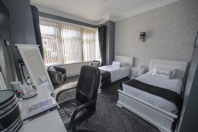 Imagen de la habitación del Hotel Tower House Executive Guest House. Foto 9