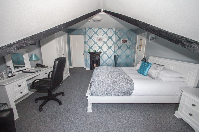Imagen de la habitación del Hotel Tower House Executive Guest House. Foto 10