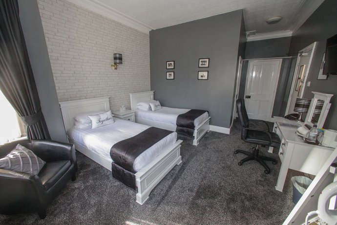 Imagen de la habitación del Hotel Tower House Executive Guest House. Foto 18