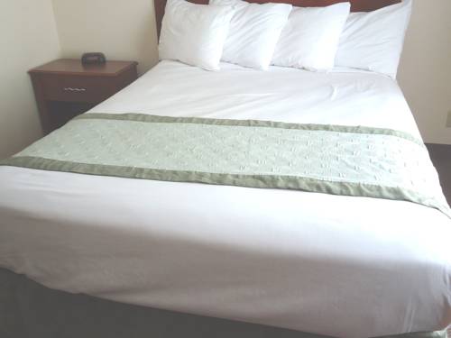 Imagen de la habitación del Hotel Town House Extended Stay Downtown. Foto 16