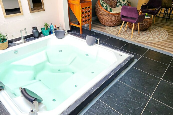 Imagen de la habitación del Hotel Town House Jiwa in Provenza. Foto 11