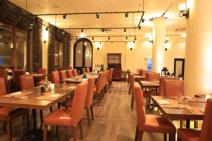 Imagen del bar/restaurante del Hotel Town Square Suites By Toscana Valley. Foto 3
