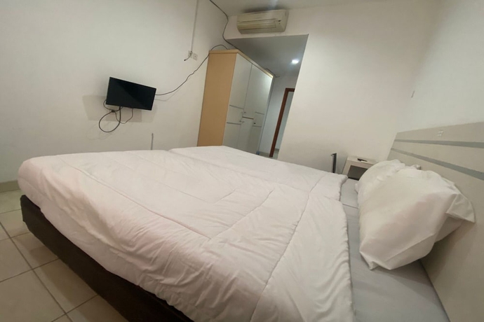 Imagen de la habitación del Hotel Townhouse OAK TOS Residence Tangerang. Foto 4
