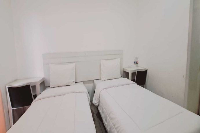 Imagen de la habitación del Hotel Townhouse OAK TOS Residence Tangerang. Foto 7