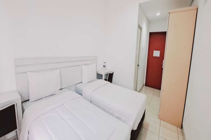 Imagen de la habitación del Hotel Townhouse OAK TOS Residence Tangerang. Foto 8