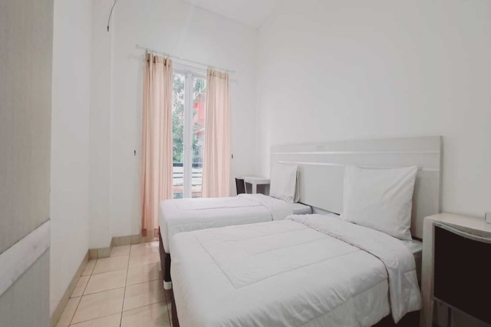 Imagen de la habitación del Hotel Townhouse OAK TOS Residence Tangerang. Foto 9