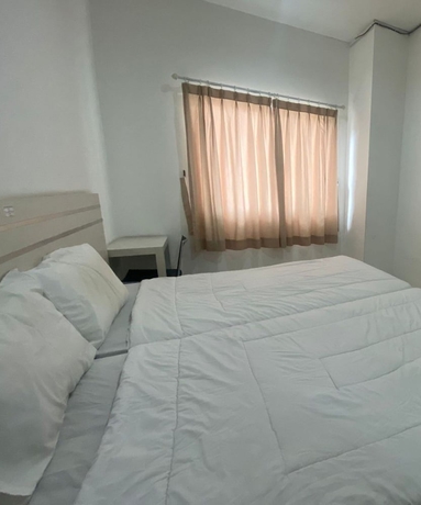 Imagen de la habitación del Hotel Townhouse OAK TOS Residence Tangerang. Foto 11