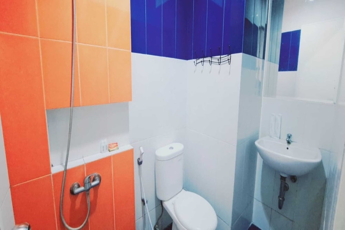 Imagen de la habitación del Hotel Townhouse OAK TOS Residence Tangerang. Foto 13