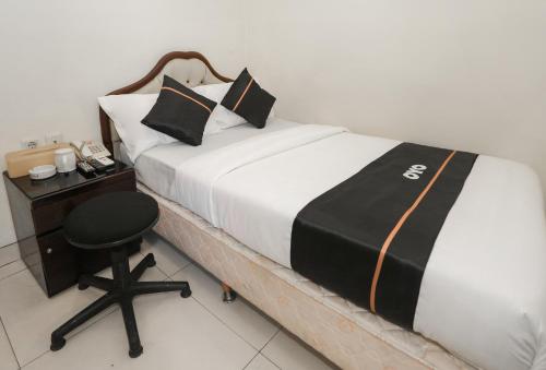 Imagen de la habitación del Hotel Townhouse Oak J&b Gunung Sahari. Foto 19
