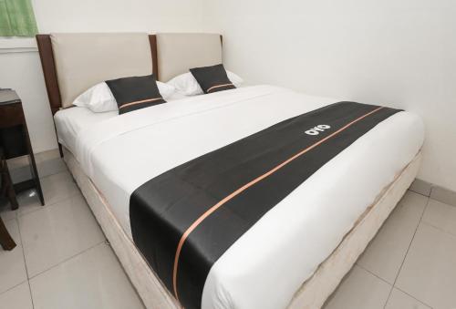 Imagen de la habitación del Hotel Townhouse Oak J&b Gunung Sahari. Foto 20
