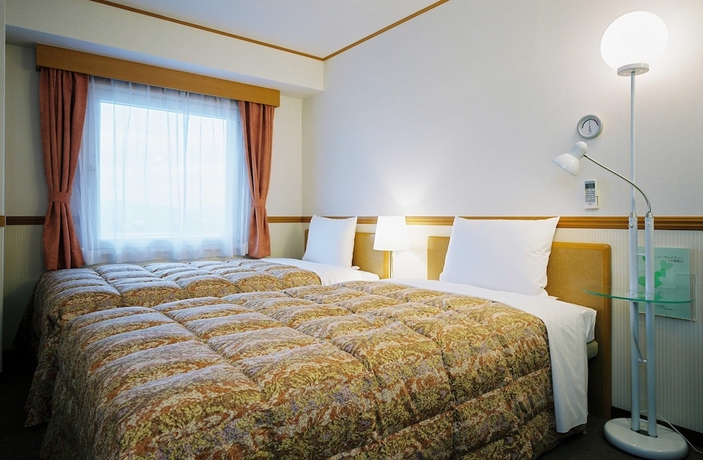 Imagen de la habitación del Hotel Toyoko Inn Higashi Hiroshima Station. Foto 13