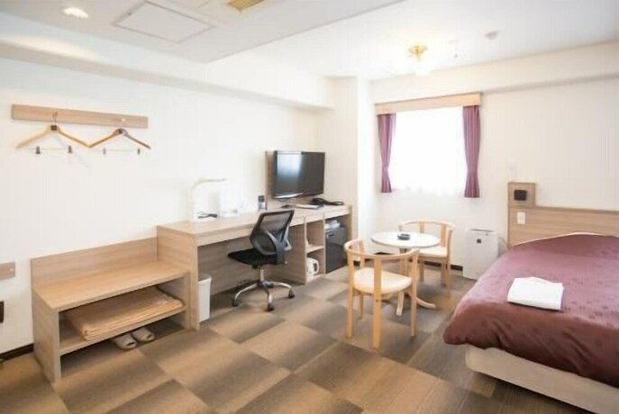 Imagen de la habitación del Hotel Toyota Prestige. Foto 13