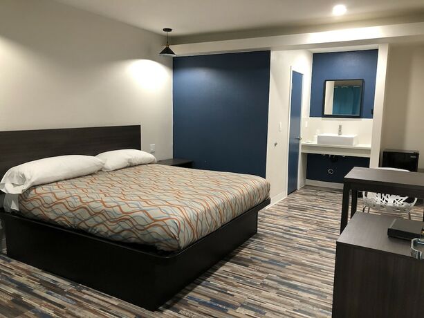 Imagen de la habitación del Hotel Tradewinds Motel. Foto 18