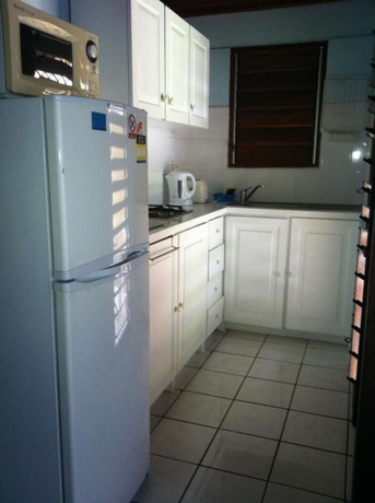Imagen de la habitación del Hotel Tradewinds Villas. Foto 10