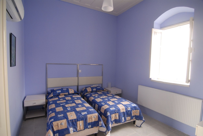 Imagen de la habitación del Hotel Traditional Village Houses. Foto 2