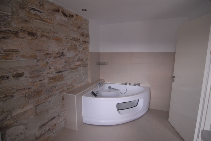 Imagen de la habitación del Hotel Traditional Village Houses. Foto 6