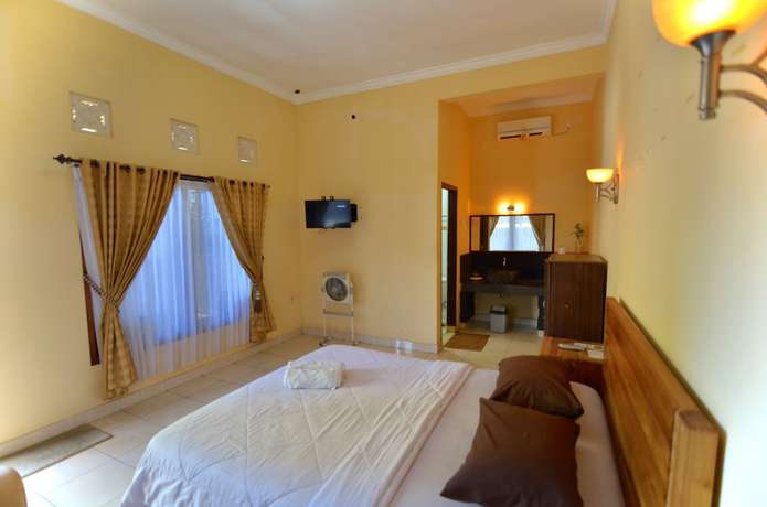 Imagen de la habitación del Hotel Transit Inn Senggigi. Foto 17