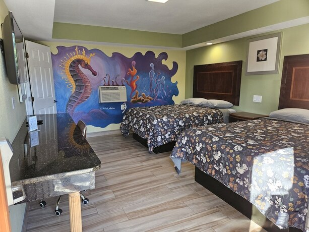 Imagen de la habitación del Hotel Travel Inn of Riviera Beach. Foto 11