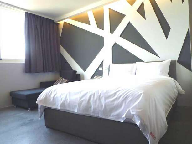 Imagen de la habitación del Hotel Travel Light Hotel. Foto 31