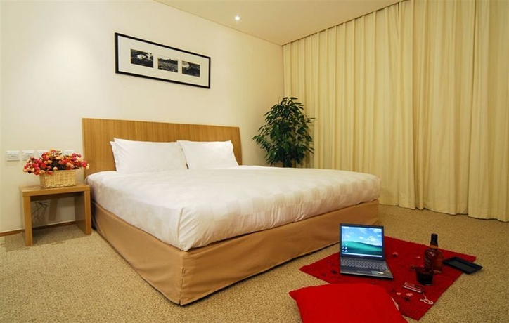 Imagen de la habitación del Hotel Traveler Inn Huaqiao Beijing. Foto 8