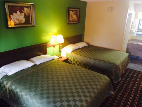 Imagen de la habitación del Hotel Traveler's Inn. Foto 4