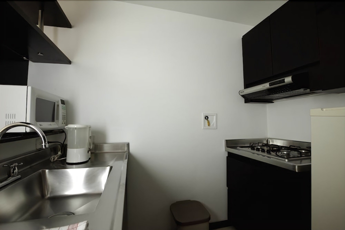 Imagen de la habitación del Hotel Travelers Orange Suites. Foto 8