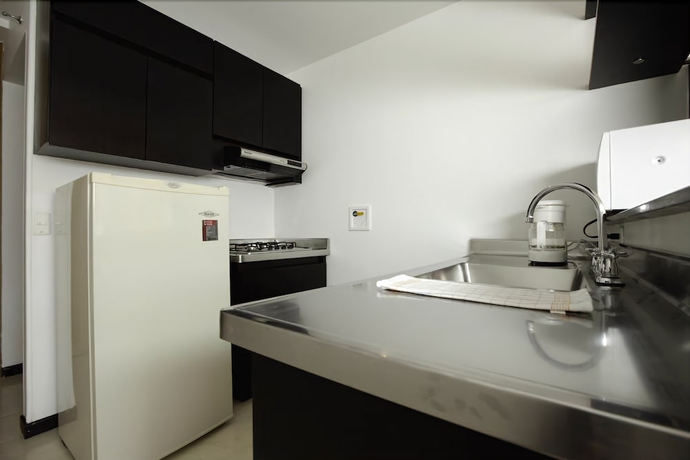 Imagen de la habitación del Hotel Travelers Orange Suites. Foto 10