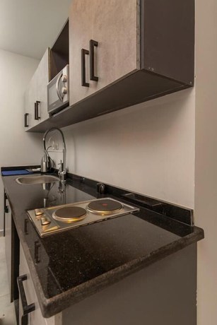 Imagen de la habitación del Hotel Travelholic Residence Golden Gates. Foto 5