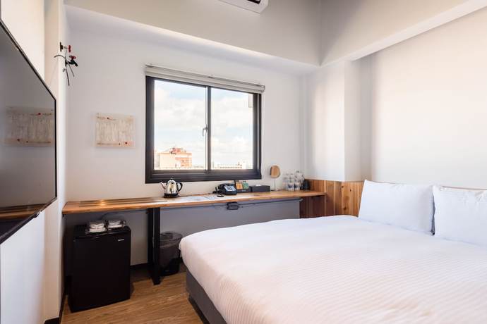 Imagen de la habitación del Hotel Traveller Inn Tiehua. Foto 9