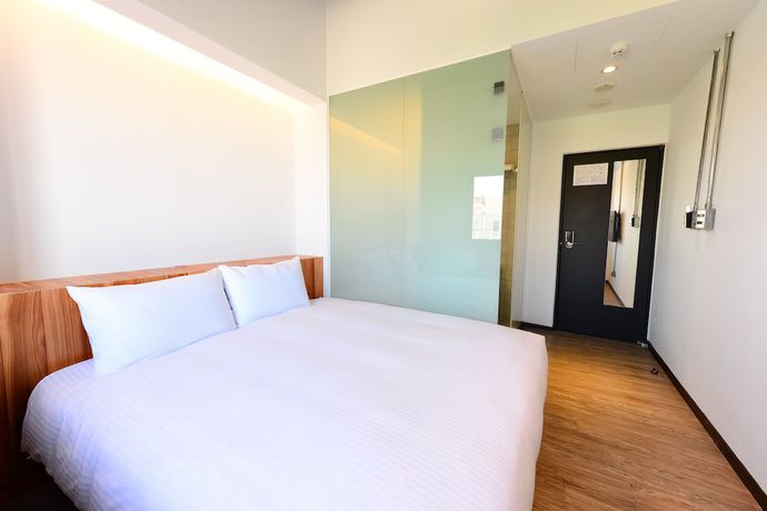 Imagen de la habitación del Hotel Traveller Inn Tiehua. Foto 12