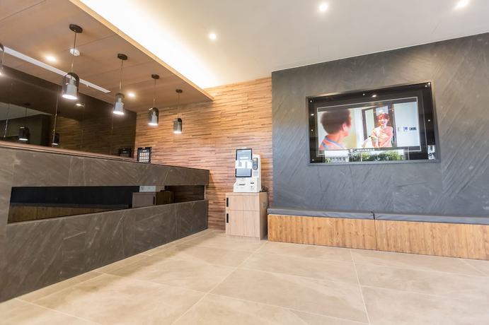 Imagen de los interiores del Hotel Traveller-inn Teihua Ii. Foto 19