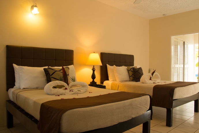 Imagen de la habitación del Hotel Travellers Beach Resort. Foto 9