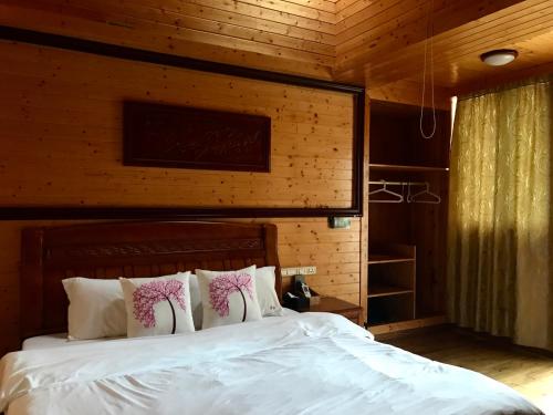 Imagen de la habitación del Hotel Travelling With Long Ji Ping An. Foto 8