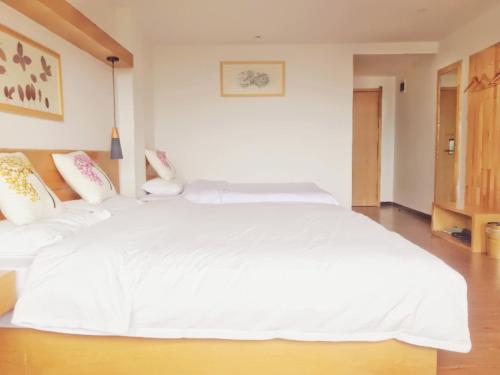 Imagen de la habitación del Hotel Travelling With Long Ji Ping An. Foto 9