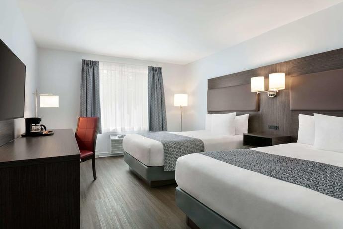 Imagen de la habitación del Hotel Travelodge By Wyndham Rigaud. Foto 7
