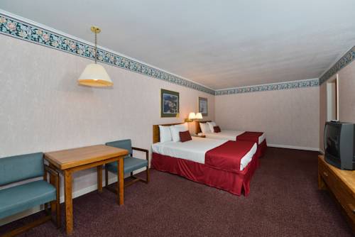 Imagen de la habitación del Hotel Travelodge by Wyndham Mackinaw City. Foto 12