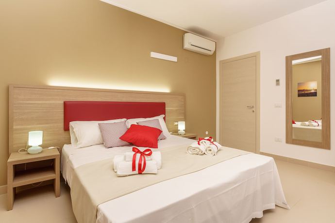 Imagen de la habitación del Hotel Travini Residence. Foto 11